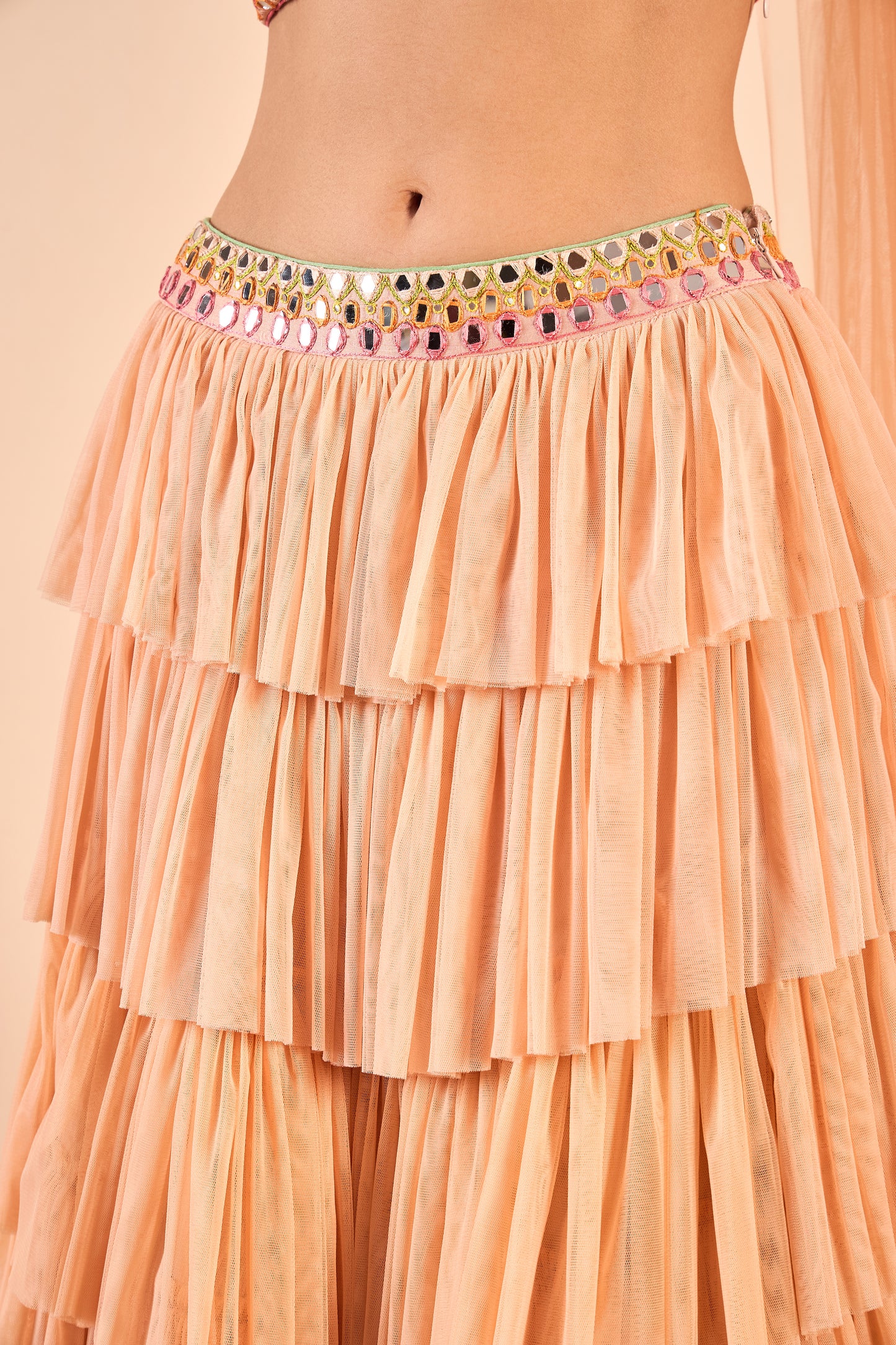 Ruffled Net Lehenga and Hand-Embroidered Mirror Work Blouse
